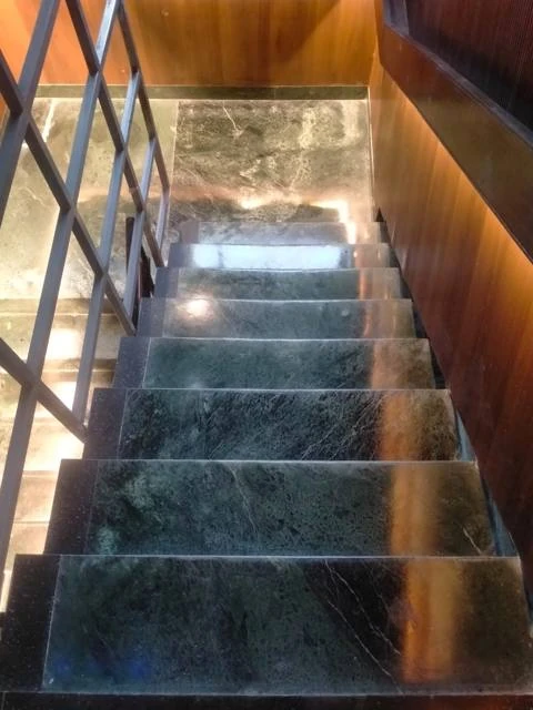 Polished marble staircase with warm lighting