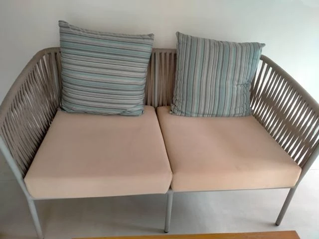 Cleaned cushioned outdoor sofa